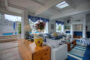 a living room with a couch and a table at Our Hermanus House in Hermanus