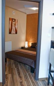 Posteľ alebo postele v izbe v ubytovaní Apartament Perłowy