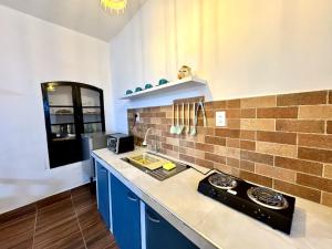 a kitchen with a sink and a stove in it at Avaroa 350 in Sucre