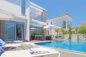 an image of a villa with a swimming pool at Villa Solebianco Protaras in Protaras