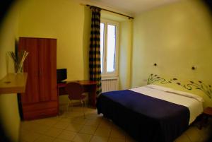 Postel nebo postele na pokoji v ubytování AlbergoTeatro