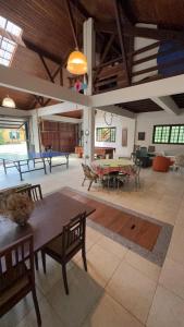 a large room with tables and chairs in it at Casa do Fachoalto in Petrópolis