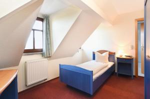 מיטה או מיטות בחדר ב-Hotel Neue Höhe