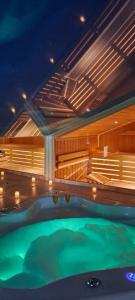 a indoor swimming pool with a green pool at Magic Spa Apartman in Sremska Mitrovica