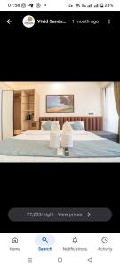 a picture of a hotel room with a bed at Vivid sand beach resort in Revadanda