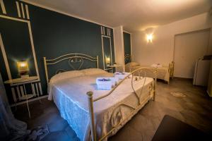 Postel nebo postele na pokoji v ubytování Marghaerita B&B