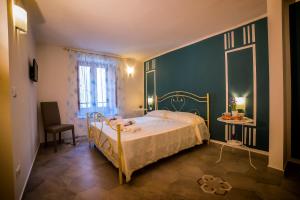 Postel nebo postele na pokoji v ubytování Marghaerita B&B