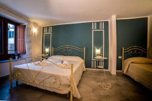 Postel nebo postele na pokoji v ubytování Marghaerita B&B