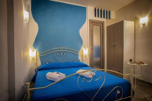 Postel nebo postele na pokoji v ubytování Marghaerita B&B