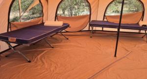 a room with two beds in a tent at Bwana Renman Campsite in Narok