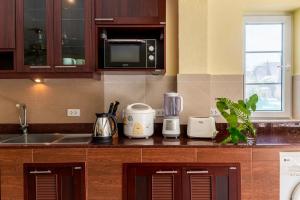 a kitchen with a counter top with appliances on it at Windy Villa by Utalay Koh Chang in Ban Khlong Son +71 photos