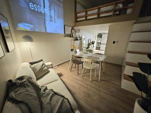 a living room with a couch and a table with chairs at 샤인 스테이 in Kung-mal +33 photos
