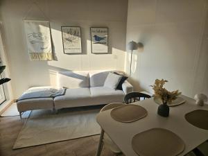 a living room with a couch and a table at 샤인 스테이 in Kung-mal