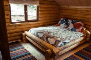 เตียงในห้องที่ Farmstead Lisova