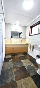 a bathroom with a sink and a mirror at Mariner Motel in Portland +37 photos