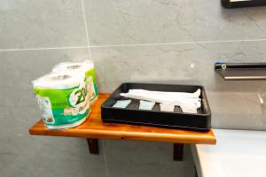 a tray of toilet paper and a bag of toilet paper at Oudomsin Guesthouse in Luang Prabang +11 photos