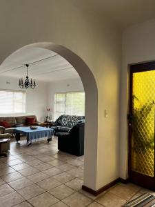 a living room with a couch and a table at Casa Bella in Dwarskersbos +11 photos