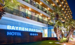 
a large building with a large clock on the front of it at Hotel RH Bayren Parc in Gandía
