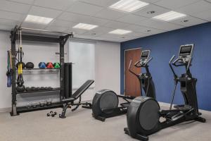 a gym with two treadmills and two exercise bikes at Hampton Inn Leesburg Tavares in Leesburg