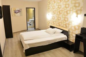 Ένα ή περισσότερα κρεβάτια σε δωμάτιο στο Casa Cojocaru- camere de închiriat în scop turistic