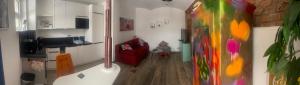 a living room with a red couch in a room at OK-City in Bayreuth
