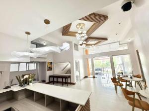 a living room with a table and some chairs at Palette Cebu The Almonds Boutique Aparthotel Near University of Cebu in Cebu City +31 photos