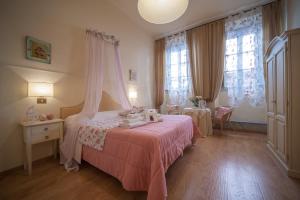 Postel nebo postele na pokoji v ubytování Albergo Etruria
