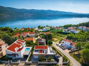 an aerial view of a town next to a body of water at Villa Karpa in Pridraga