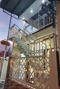 a staircase on the side of a building with lights at SUN Homestay Vĩnh Hy in Vĩnh Hy