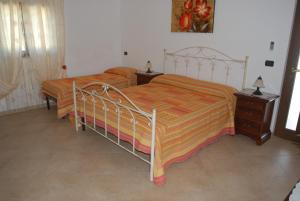 Postel nebo postele na pokoji v ubytování B&B Parcomonsignore