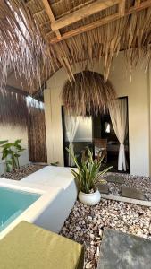 a villa with a swimming pool and a resort at Ginhawa Stay Private Pool Studio in Burgos
