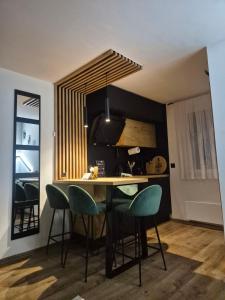 a kitchen with a table and chairs in a room at Holiday house Aria Vučedol in Vukovar