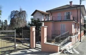 a pink house with a gate in front of it at Rio Molino 1 in Stresa