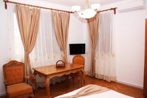 TV a/nebo společenská místnost v ubytování Casa Craiova Nuova