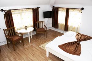 Postel nebo postele na pokoji v ubytování Casa Craiova Nuova