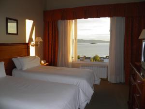 Cama ou camas em um quarto em Terrazas Del Calafate