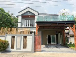 a house with a balcony on top of it at Sufficient House in Nong Prue +14 photos