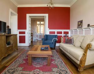 a living room with a couch and a coffee table at Pontoval B&B in Valparaíso