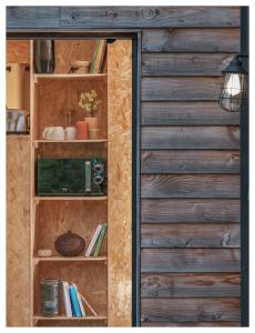 a door to a book shelf with books at Volvic Organic Resort in Volvic