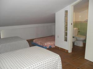 A bed or beds in a room at Alcaraván 32