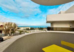a yellow bench sitting on top of a building at LifeStyle Boutique Apartment in Monopoli