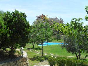 a resort with a swimming pool and a building at La Alberquilla in Yeste