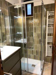 a bathroom with a shower and a sink at i GERMÅNI REALI in Scanno +40 photos
