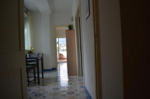 a hallway with a dining room and a table in a room at Casa Cecilia in Ravello