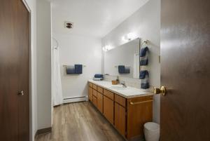 a bathroom with a sink and a mirror at Americas Best Value Inn Polson in Polson +129 photos