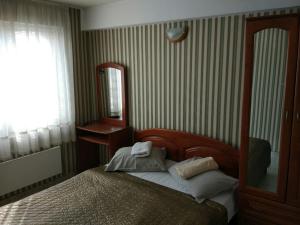 Postel nebo postele na pokoji v ubytování Family Hotel Kartala