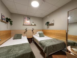 a hospital room with two beds in it at Nässjö Vandrarhem in Nässjö