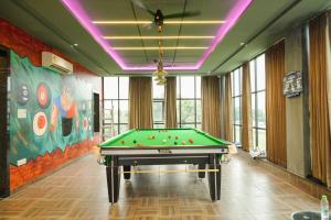 a billiard room with a pool table in it at The Carnation Mound in Haldwāni