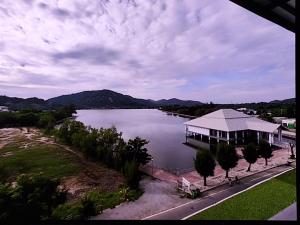 a view of a large lake with a house at Turtle Nest in Hua Hin