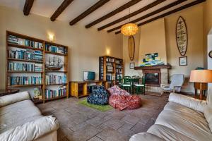 a living room with two couches and a fireplace at FreeSurfCamp in Peniche